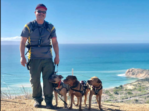 Felix with (L-R) Vivian who is a board and train rescue client, and his personal dogs Cora and Cleo